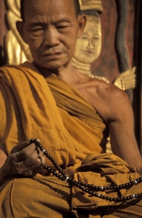 A Monk With Mala Beads